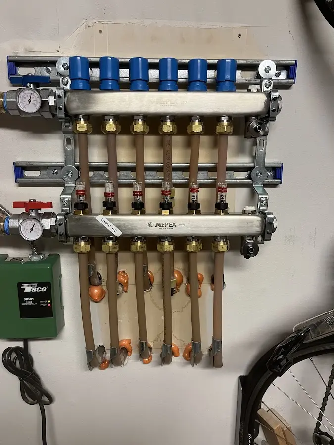 Plumber performing Water Heater Repair at a residential property in Mattawan